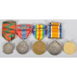 A collection of medals, comprising : A First World War British War Medal,