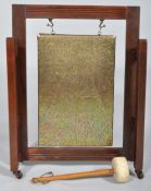 An Edwardian oak framed dinner gong, the frame reeded, with tooled brass gong,