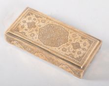 A Middle Eastern white metal rectangular cigarette box, engraved all over with Mughal designs,