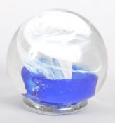 An Isle of Wight Studio Art glass paperweight incised marks, with white and blue spiral inclusions,