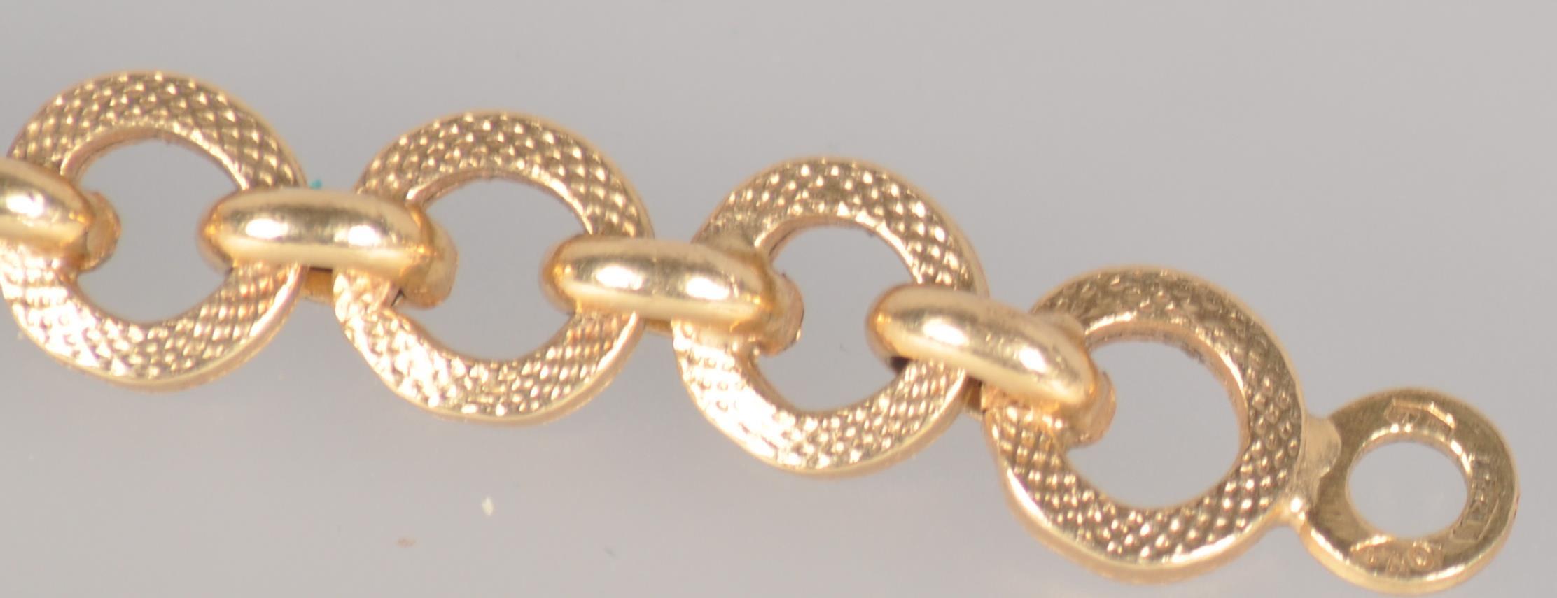 A yellow metal linked bracelet, 6 ½ inch length, bolt ring clasp. - Image 3 of 3