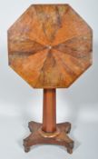 A 19th century William IV mahogany and rosewood octagonal tilt top table with octagonal column,