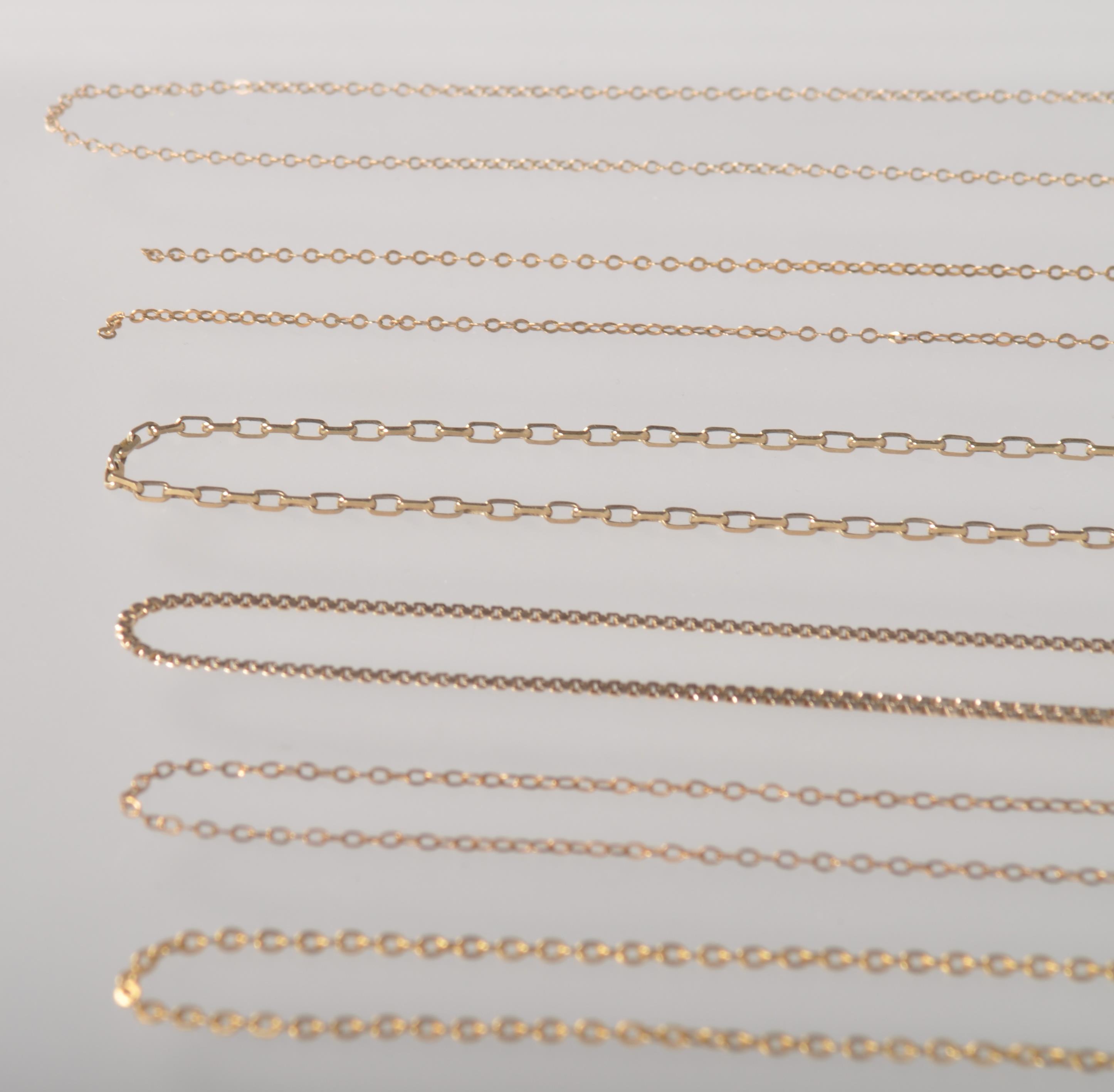 A collection of six yellow metal linked necklace chains. - Image 3 of 3