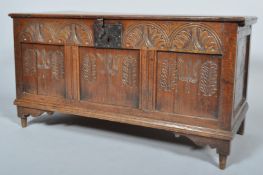 An 18th century panelled oak coffer/mule chest with twin plank top, candle box,