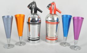 A Retro Sparklets cocktail set, mid 20th century, comprising : two stainless steel soda syphons,