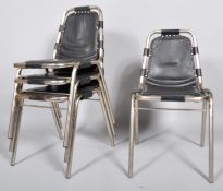 A set of four steel and leather dining chairs in the style of Charlotte Perriald, 'Les Arts' model,