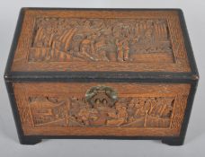A Chinese carved camphor hinged rectangular box,