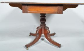 A 19th century mahogany Pembroke table having drop leaf top with single drawer,