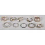 Ten assorted white metal rings, some stamped .