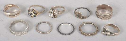 Ten assorted white metal rings, some stamped .