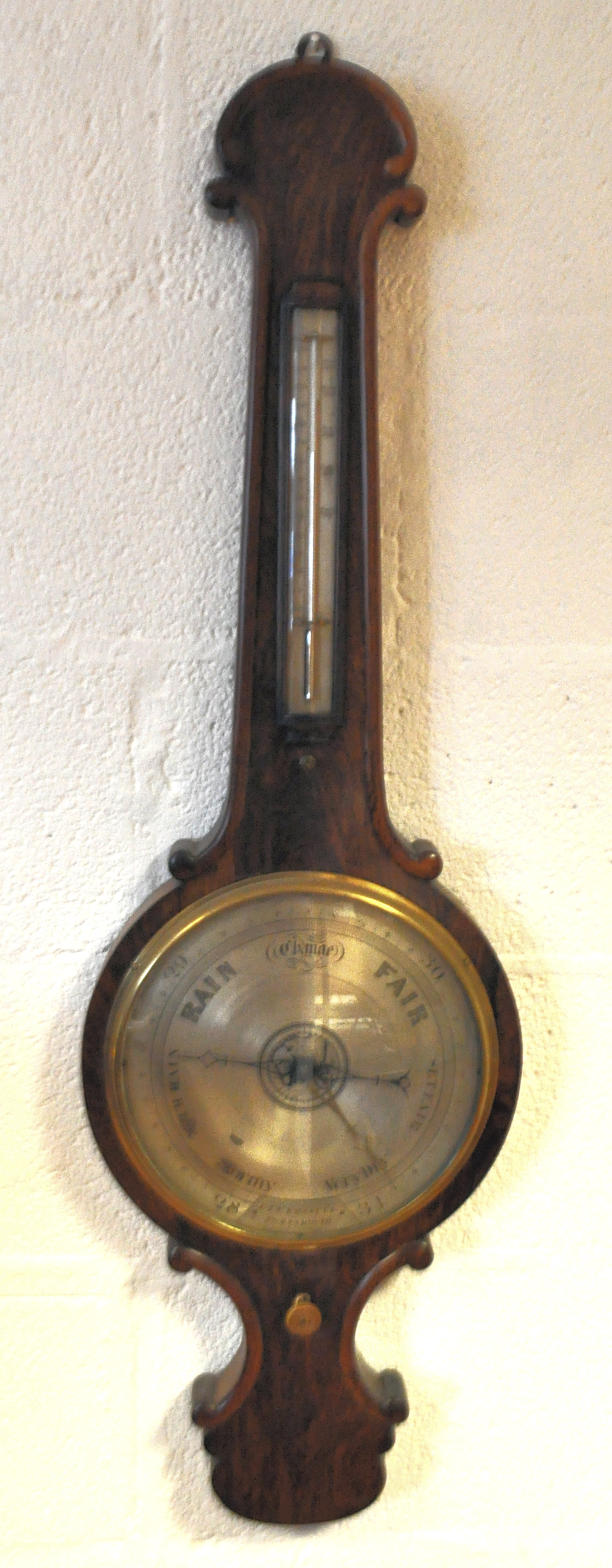 A mid 19th century rosewood Banjo barometer, the 25cm inlaid dial labelled E & E Emannuel,