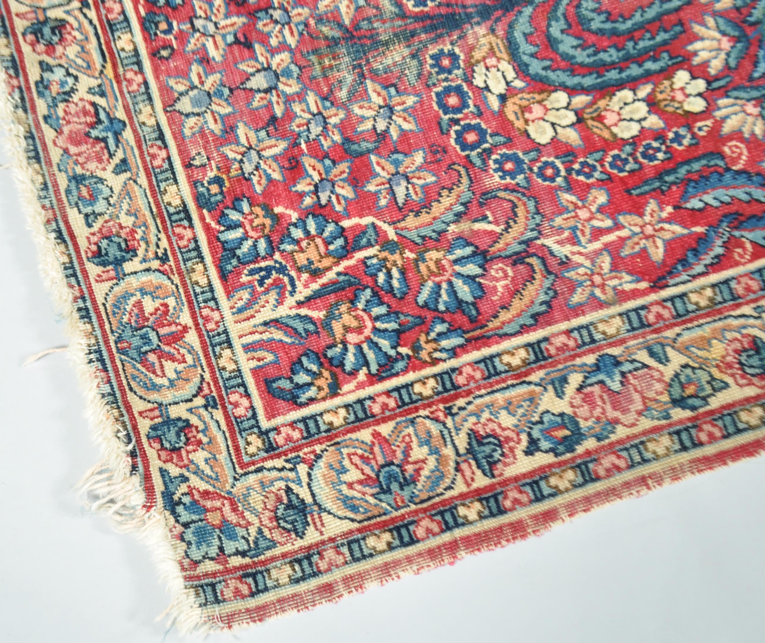 A Middle Eastern small scale carpet claret centre ground, - Image 2 of 3