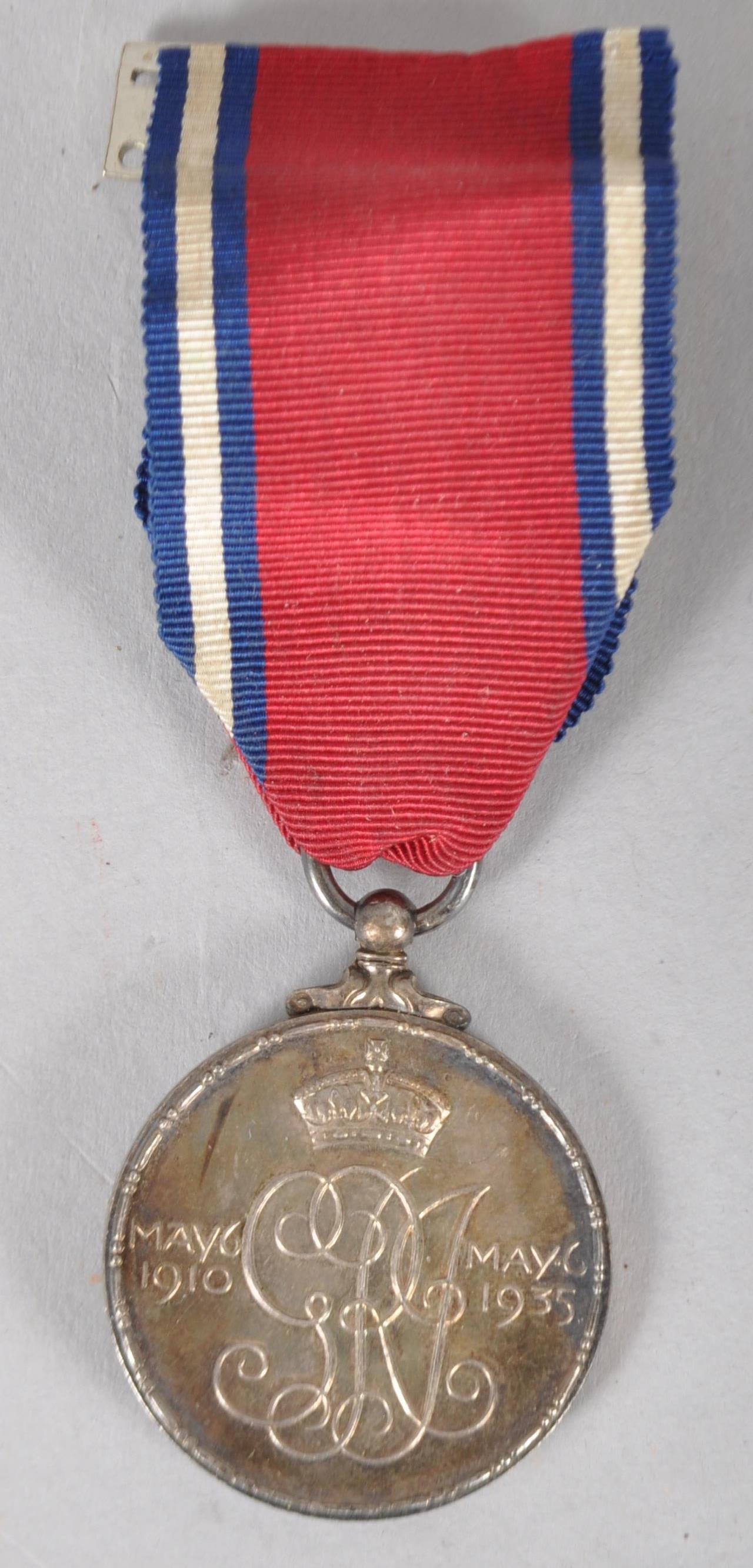 A George V and Queen Mary Jubilee medal,