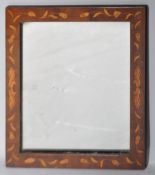 A 19th century mahogany marquetry inlaid mirror frame, of rectangular form,