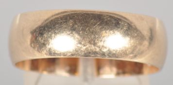 A yellow metal 7.0mm D shape wedding ring. Hallmarked 9ct gold, Sheffield, 1993.