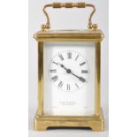 A French brass carriage clock, retailer's marks for S Smith & Son, 104 Strand,