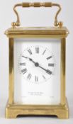 A French brass carriage clock, retailer's marks for S Smith & Son, 104 Strand,