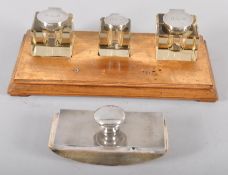 A mahogany ink stand, the three square glass ink wells with silver lids, Birmingham 1919/20,