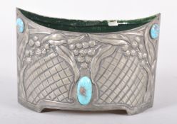 An Art Nouveau turquoise-mounted pewter oval jardiniere, circa 1900,