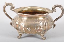 A silver sugar bowl, of shaped round form,
