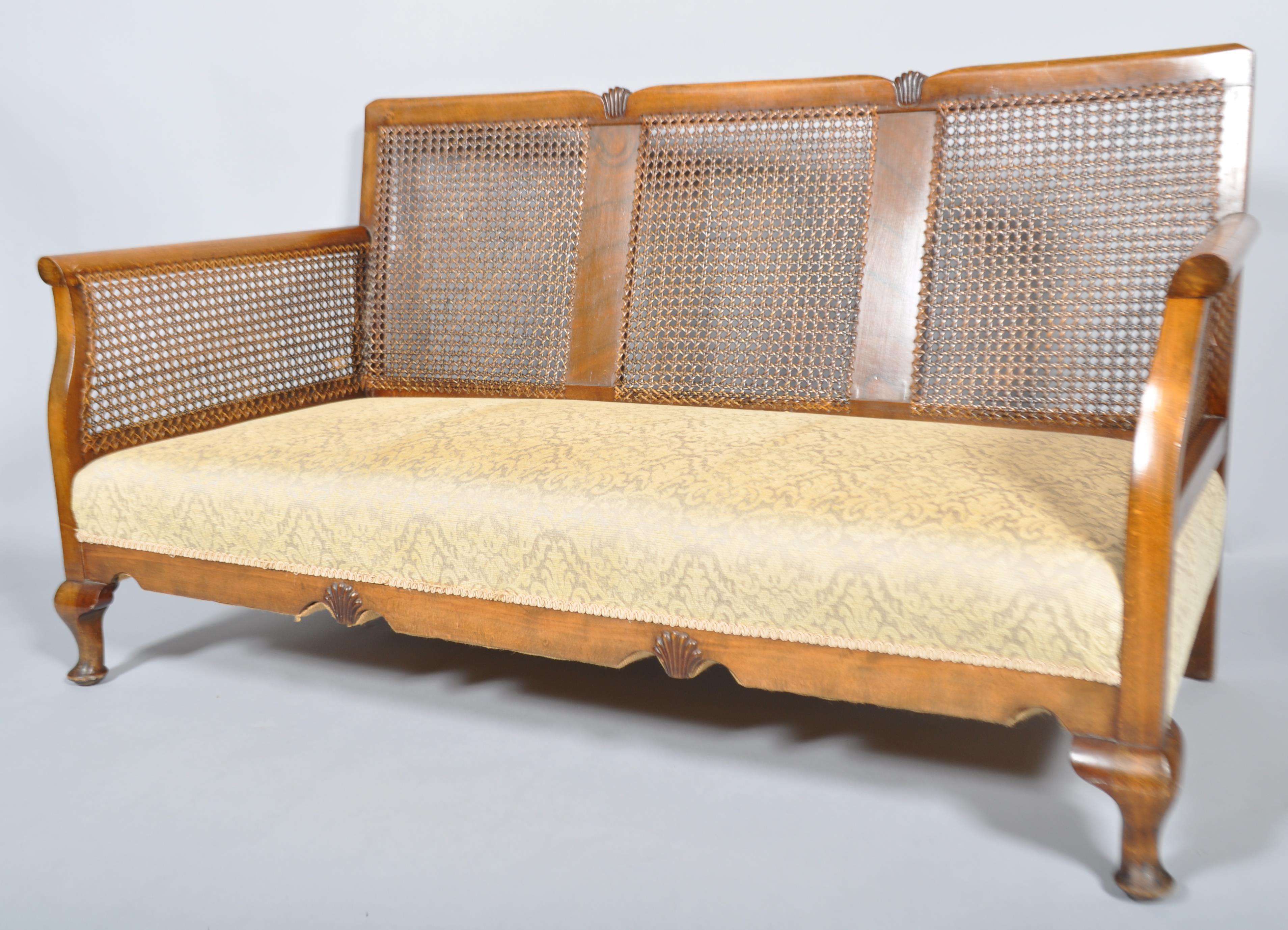A 1930's art decor walnut and bergere cane work sofa suite