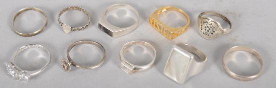 Ten assorted white metal rings, some stamped .