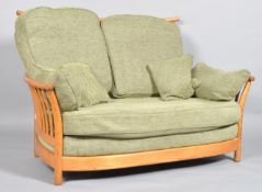 An Ercol Renaissance Gold Dawn tow seater sofa, with high back,