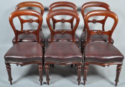 A set of six Victorian mahogany balloon back dining chairs,