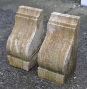 A pair of contemporary ham stone corbels of traditional form.