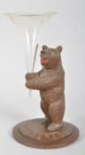 A carved Black Forest style bear vase,