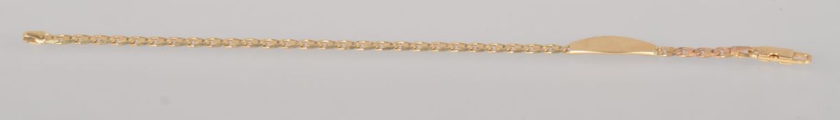 A yellow metal anchor link bracelet with identity panel, 7 ½ inch length, trigger clasp.