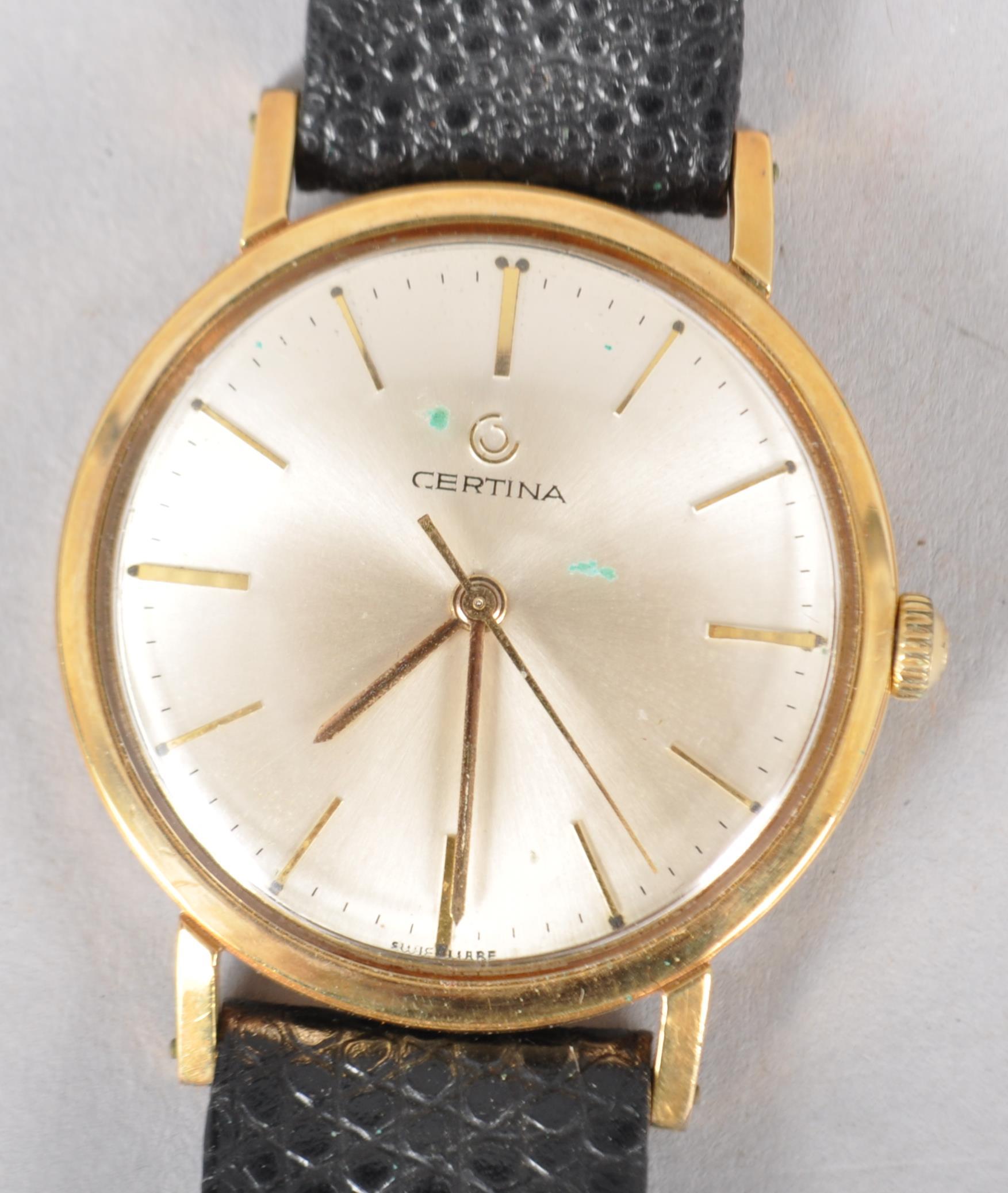 A gold plated mechanical Certina wristwatch. Circular silver dial with baton markings.