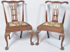 A pair of 19th century mahogany dining chairs with pierced splats,