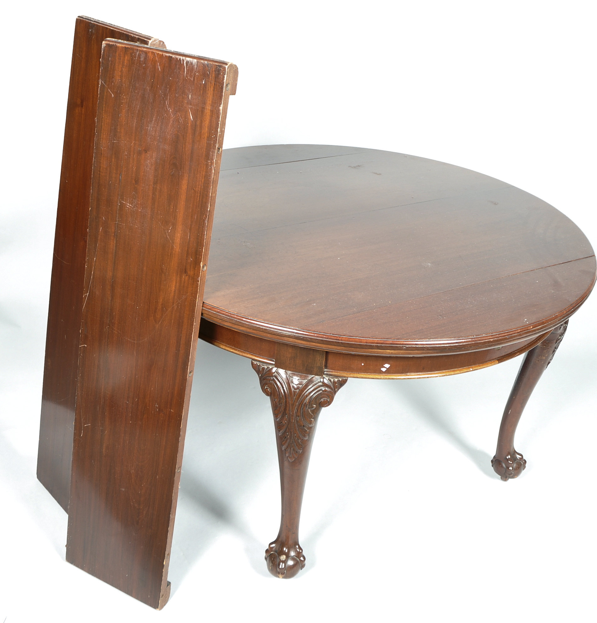 A mahogany extending dining table in the George III style, of circular form with one leaf, - Image 2 of 2