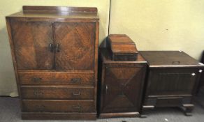 An oak cupboard together with two other cupboards