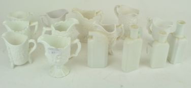 A group of white opaline glass milk jugs and bottles