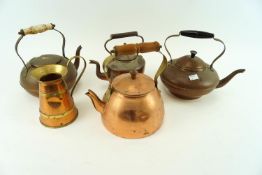 A collection of copperware kettles and a jug