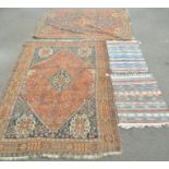 Two Persian carpets and two others