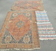 Two Persian carpets and two others