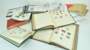 A box of loose stamps and an album