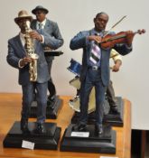 A set of four Bird figures , Sax, Pianist,