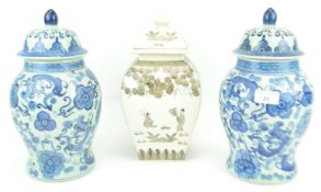 A pair of 20th century chinese style vases with another