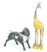 A giraffe figure and a bull