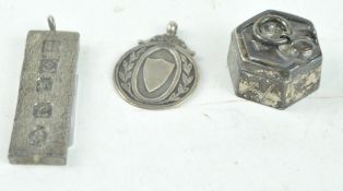 A silver ingot and other items