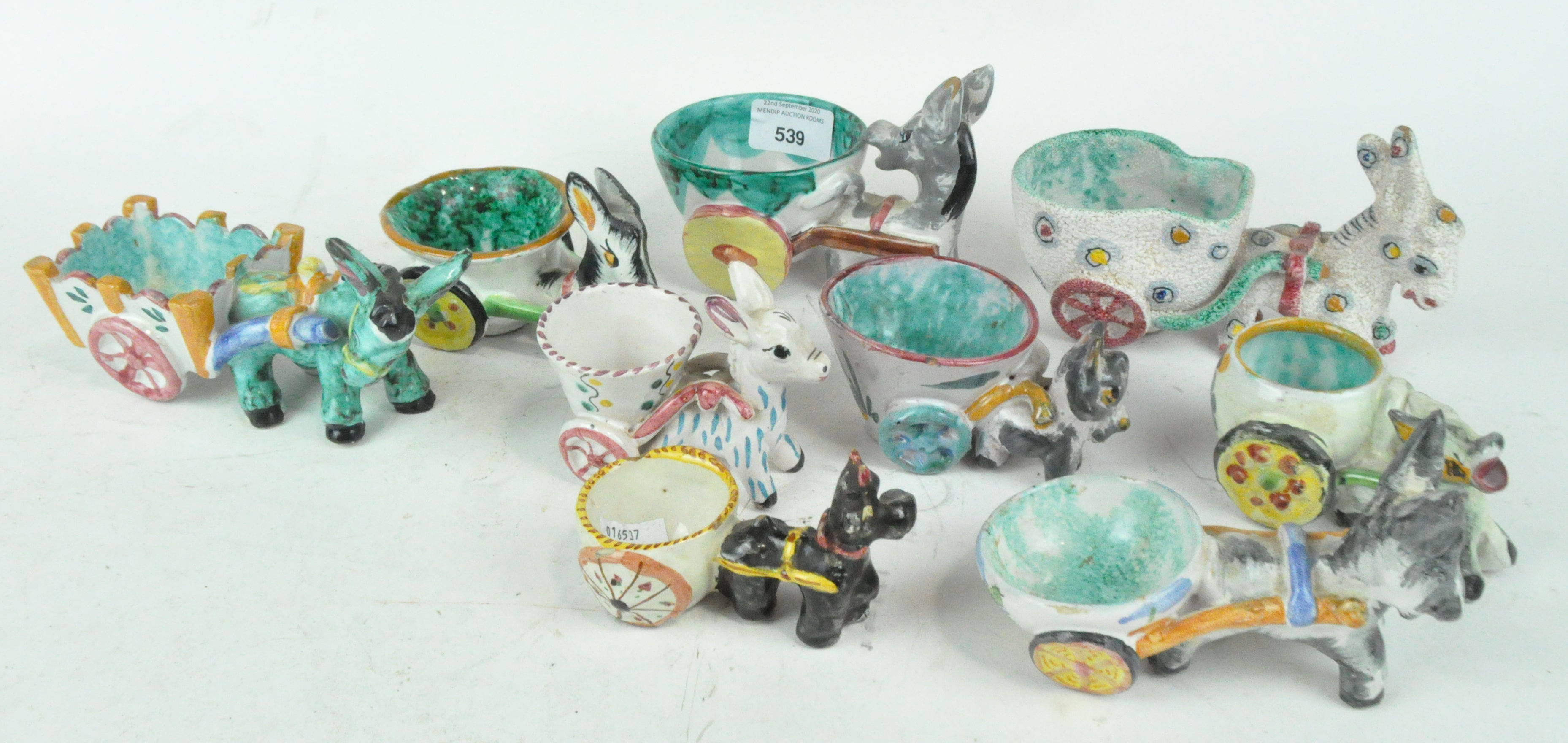 A collection of porcelain, to include a donkey and cart models,