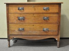 An oak chest drawers with arts and crafts handles