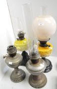 Two opaline glass oil lamps and to others