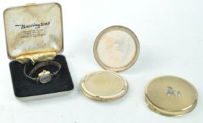 Gold watch and two compacts