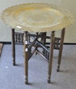 A brass tray top table