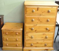 A five drawer chest of drawers and bedside unit